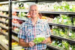 Senior man picking out salad