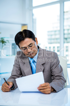 Businessman looking at document