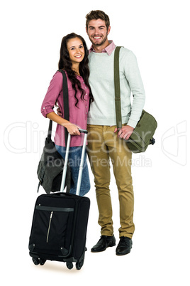 Portrait of smiling couple with luggage