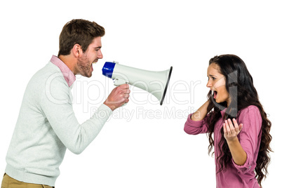 Screaming couple  with man holding loudspeaker