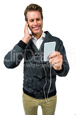 Happy man listening music on mobile phone