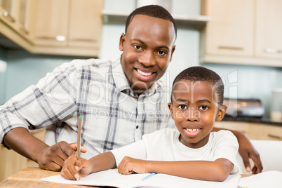 Father helping son for homework