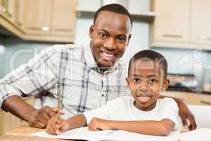 Father helping son for homework
