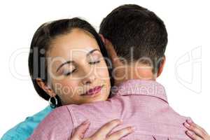 Calm couple hugging with eyes closed