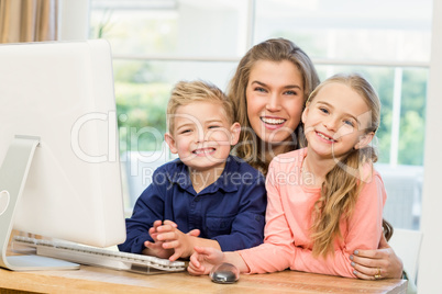 Happy family using the computer