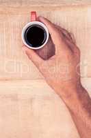 Close-up of businessman holding black coffee
