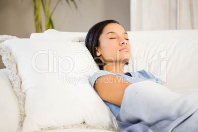 Sleeping brunette on the sofa