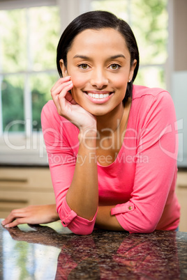 Portrait of smiling brunette in kitchen