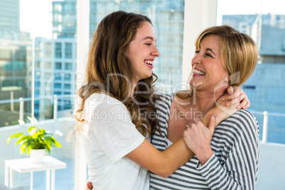 Mother and daughter smiling