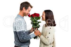 Romantic couple holding red roses