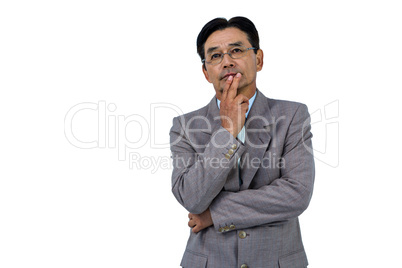 Businessman with hand on chin