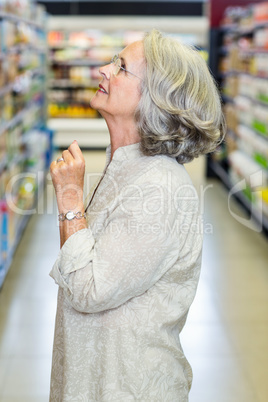 Senior woman choosing products to buy