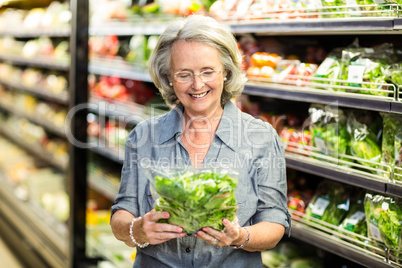 Senior woman picking out some vegetables