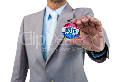 Businessman holding a badge