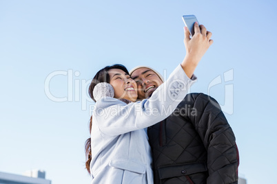 Cute couple taking selfie