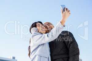 Cute couple taking selfie