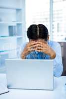 Worried businessman working at his desk