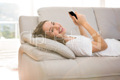 Happy woman holding phone