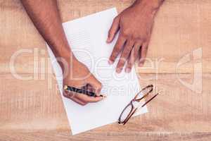 Businessman writing on paper