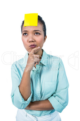 Businesswoman looking at the signe on her forehead