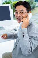 Asian businessman making a phone call