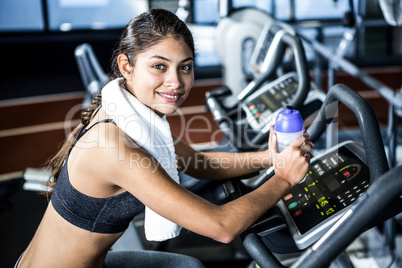 Smiling fit woman looking at camera