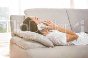 Happy woman calling on sofa