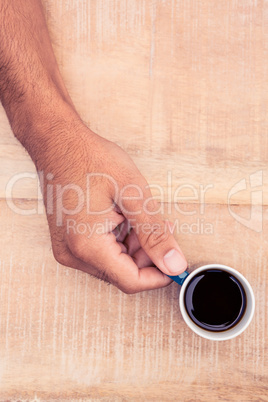 Close-up of businessman holding coffee