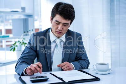 Concentrated asian businessman