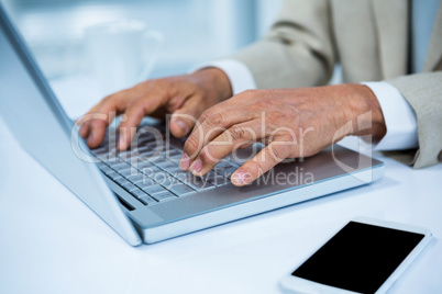 close up view of a businessman using his laptop