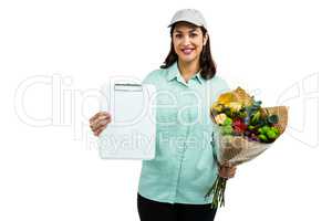 Portrait of cheerful delivery woman with flower bouquet