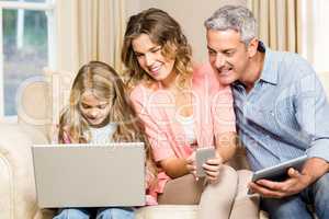 Happy family looking at laptop screen