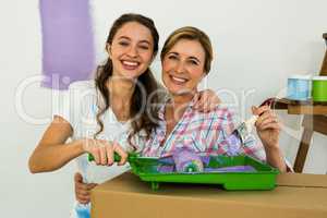 Mother and daughter preparing the paint