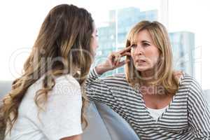 Worried mother talking to daughter