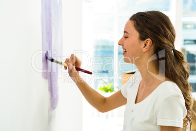 Girl smiling and painting