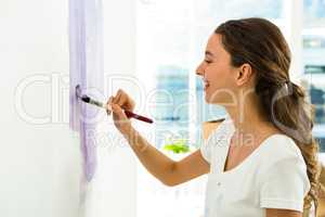 Girl smiling and painting
