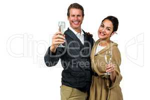 Portrait of dmiling couple holding wine glasses