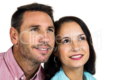 Smiling couple looking up