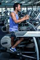 Smiling man working out with headphones on