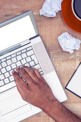 Cropped image of stressed businessman using laptop