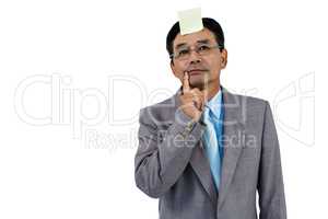 Businessman with blank note on forehead