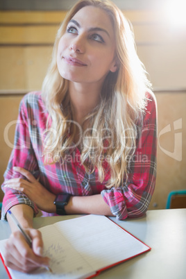 Thoughtful female student during class