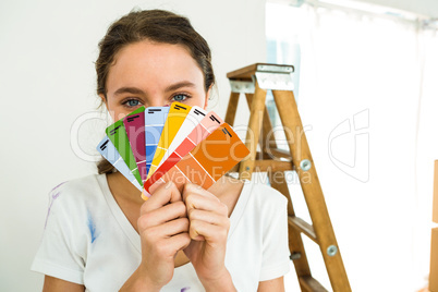 girl showing color samples