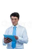 Serious businessman using his tablet