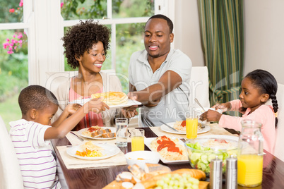 Happy family eating together