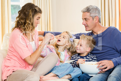 Happy family enjoying a movie together