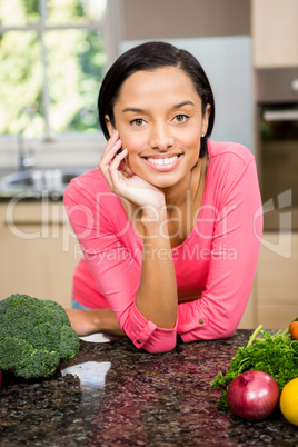 Portrait of smiling brunette in kitchen