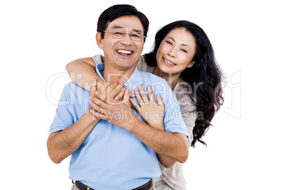 Smiling couple holding each other