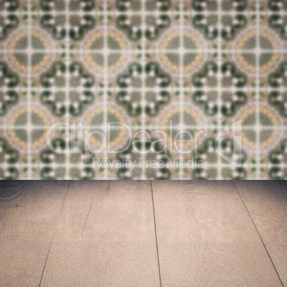 Wood table top and blur vintage ceramic tile pattern wall