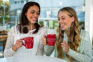 two girls drink tea